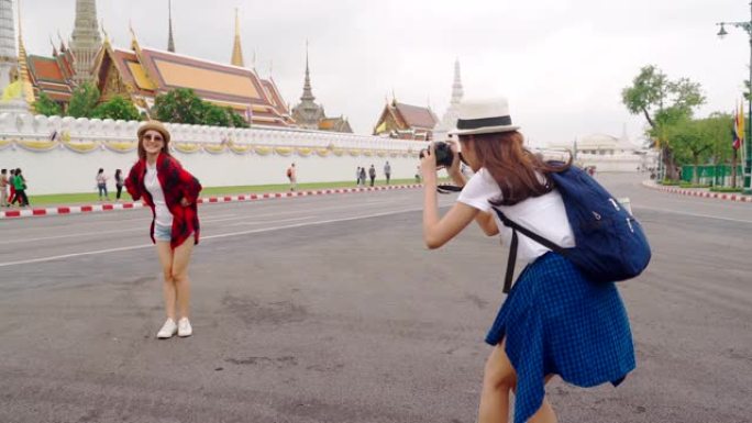 泰国日本同胞的女导游参观该国的主要景点。“Wat Phra Kaeo” 泰国曼谷地标