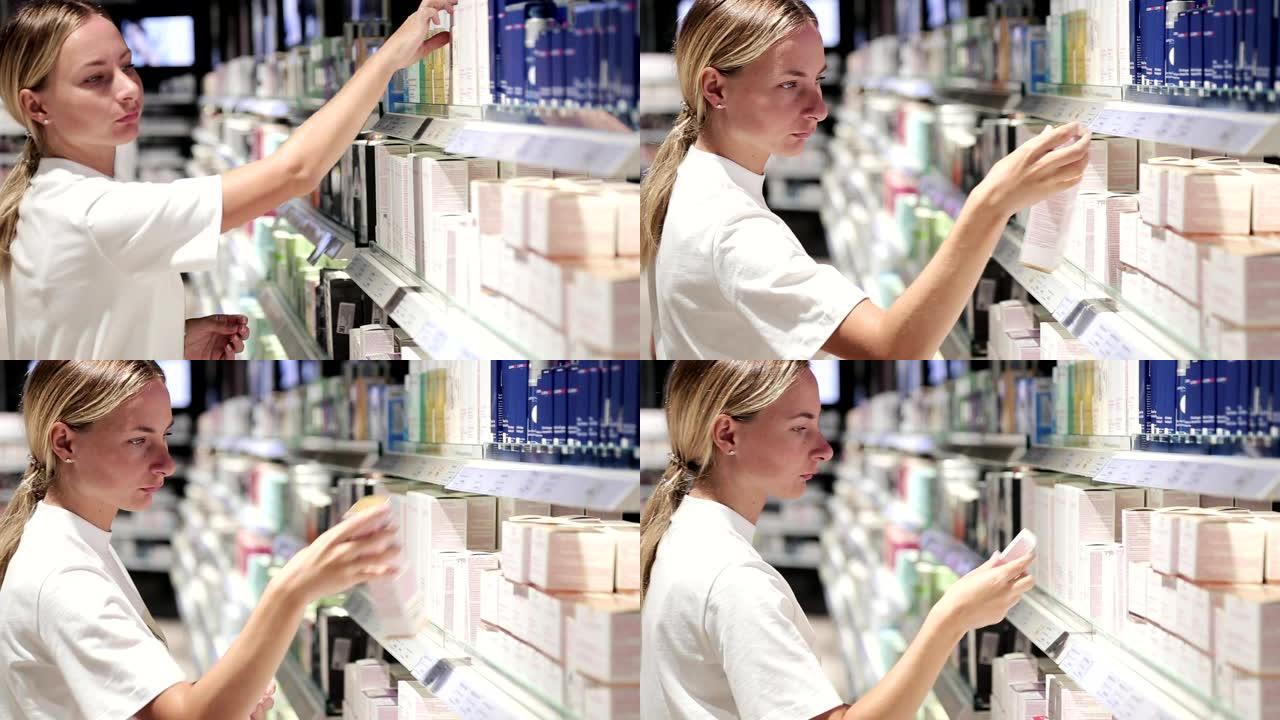 零售商店里闻到香水的休闲金发年轻女子。美丽的金发女士在美容店测试和购买化妆品
