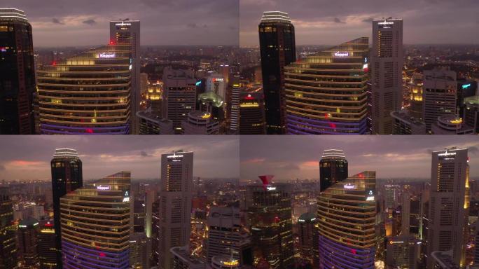 日落时间照明飞行在新加坡市中心屋顶空中全景4k