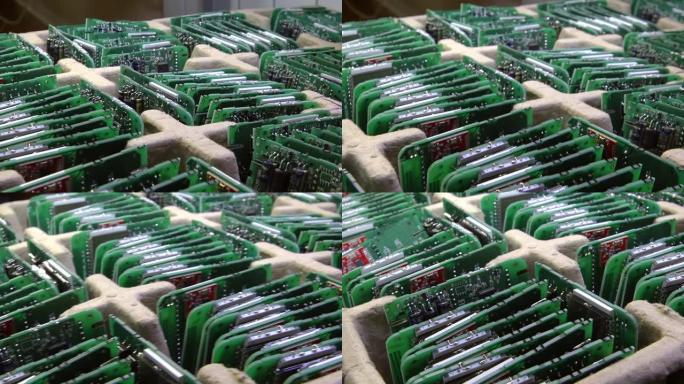 微芯片生产厂。工艺流程。在工厂生产和组装pcb和芯片。木板排成一排。