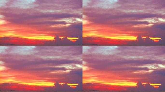 夕阳红黄橙的天空和淡红色的云移动