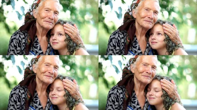 两代同堂，孙女在乡下度假。在花园里的村庄里的孙女和祖母的肖像