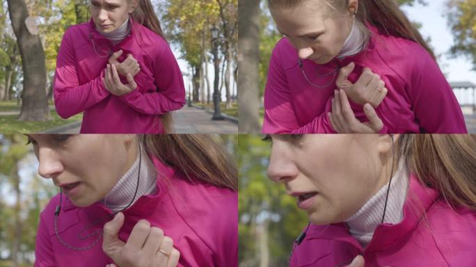 一位穿着粉红色运动服的迷人白人妇女的特写镜头，胸痛