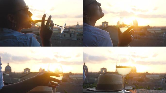 日落时，来自坎皮多利奥露台的罗马城市景观全景前，年轻女子旅游时尚白色连衣裙配一杯白葡萄酒。地标，意大