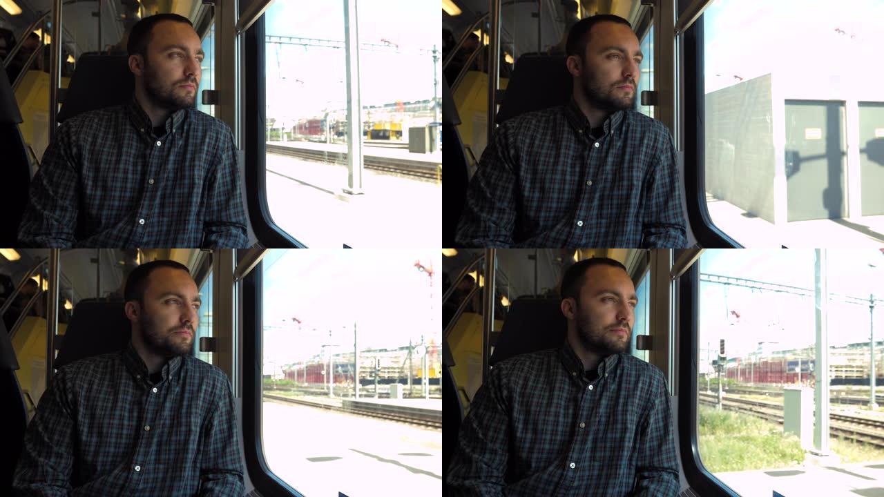 年轻人坐火车时看着窗外