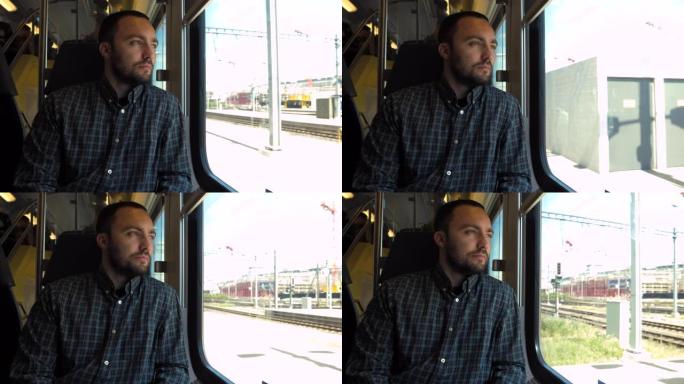 年轻人坐火车时看着窗外