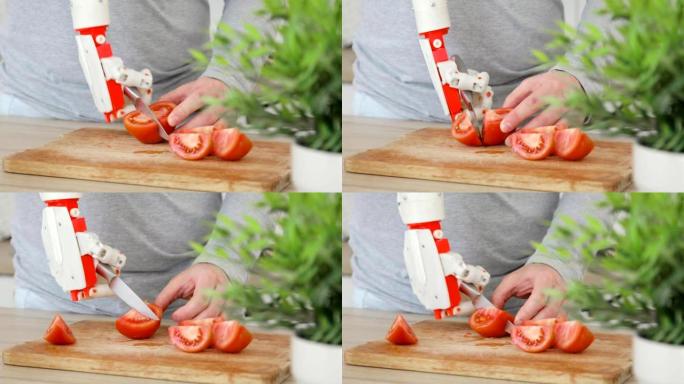 男人用机器人假肢的手用刀在木板上切番茄。肌肉再神经支配技术