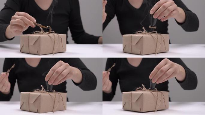 用密封蜡密封礼物的侧视图。蜡印。复古风格。孤立的选择性聚焦镜头