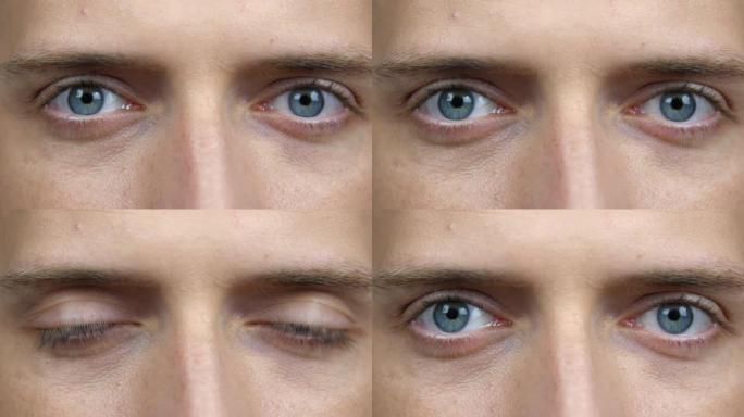 特写一只年轻男性的眼睛。一个白人男人看着相机的蓝眼睛。