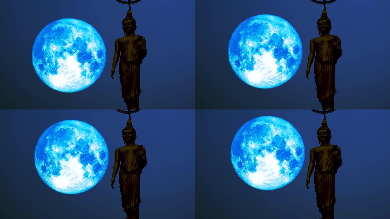 超蓝收获月亮在夜空和剪影佛像上移动