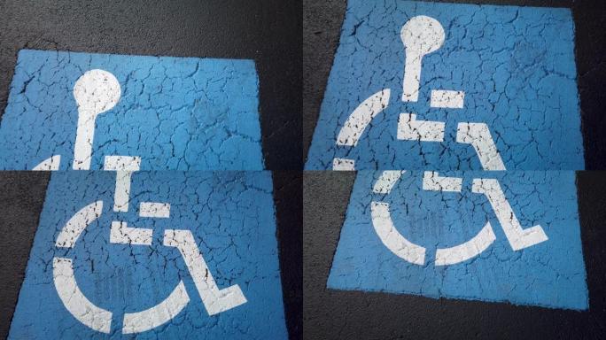 停车场人行道上的蓝色残疾人停车位，自上而下，向下平移。