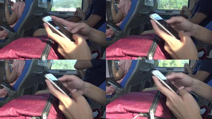 亚洲女性在公交车上使用触摸屏智能手机设备4k