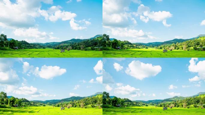 泰国炎热的夏日，4k延时拍摄在晴朗的蓝天中移动的白云，阳光穿过山脉，稻田和小小屋