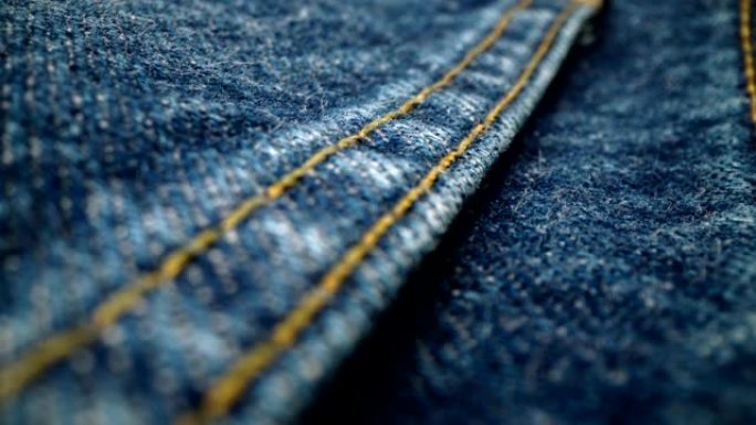 极端详细的蓝色牛仔牛仔裤纹理在多莉拍摄在布料表面。