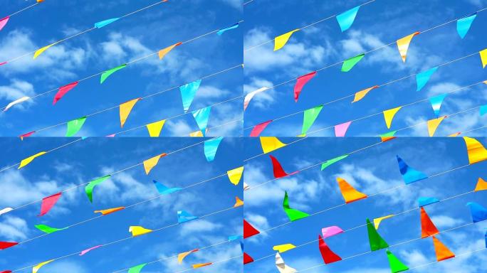 蓝天白云随风移动的彩色三角旗线