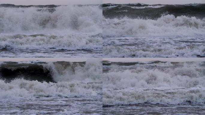 极大的海浪撞击海岸，太平洋美丽的海浪。超级慢动作。风暴期间的海浪。强大的海上热带飓风。全球变暖。恶劣