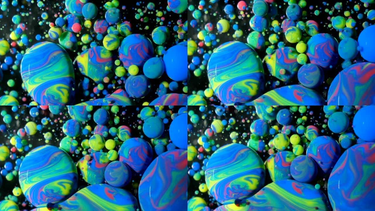 彩色气泡油美丽的油漆宇宙颜色移动五彩。丙烯酸涂料。神奇的催眠表面。色彩艳丽的变态彩色气泡在油漆油表面