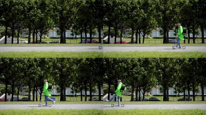 身穿绿色制服的年轻食品快递员在慢动作中骑着踏板车沿着城市街道行驶，背后是隔热背包