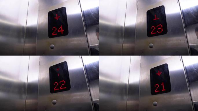 带有箭头向下的电梯中的数字显示显示从24到20的楼层