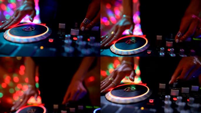 DJ女孩混合现代转盘。Dj动手调音台，跳舞和播放音乐，特写