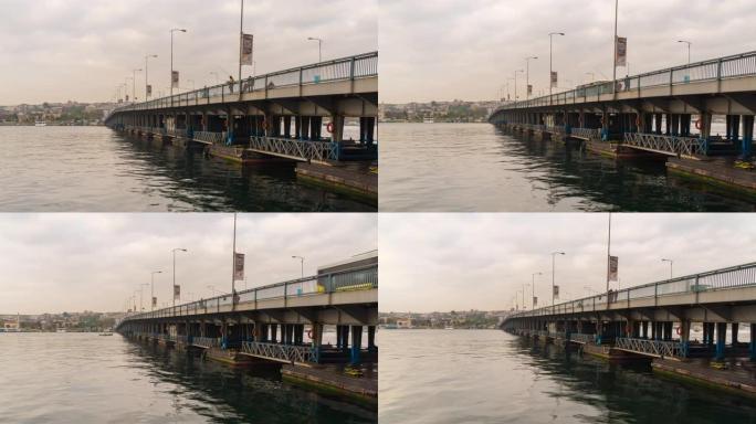 时间流逝: 土耳其伊斯坦布尔市阿塔图尔克大桥横跨金角海的全景景观