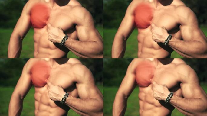 英俊的赤膊健美运动员在健身房艰苦训练后显示胸部发炎。运动员肌肉组织发炎。运动或比赛时的运动创伤。患有