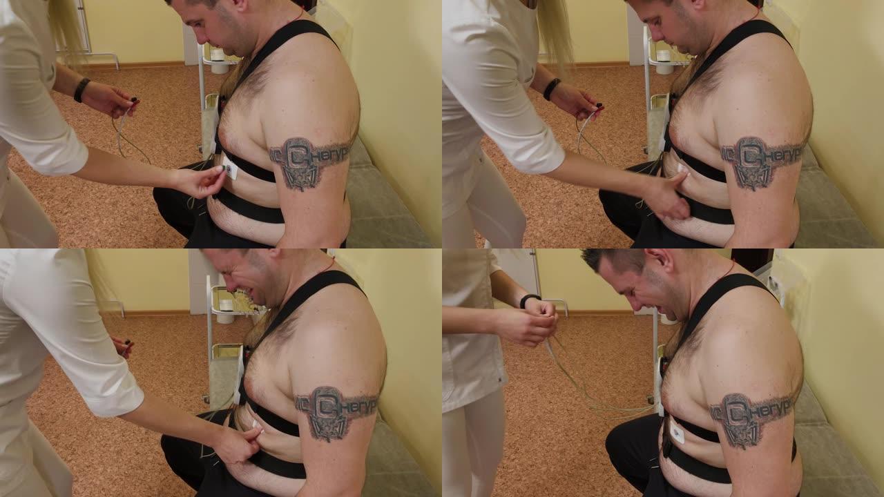 对于诊所中的患者，男护士在其身上放置了一个设备以研究身体参数