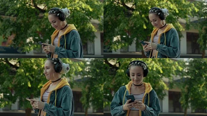 迷人的女人在city walk上使用智能手机在耳机中听音乐