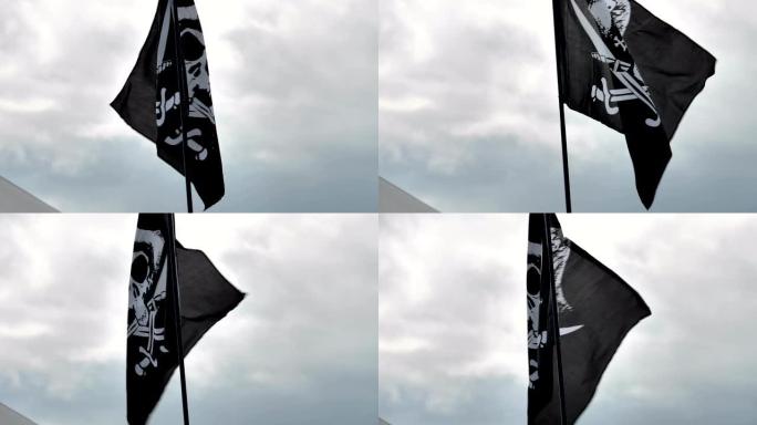 一面在微风中飘扬的黑海盗旗