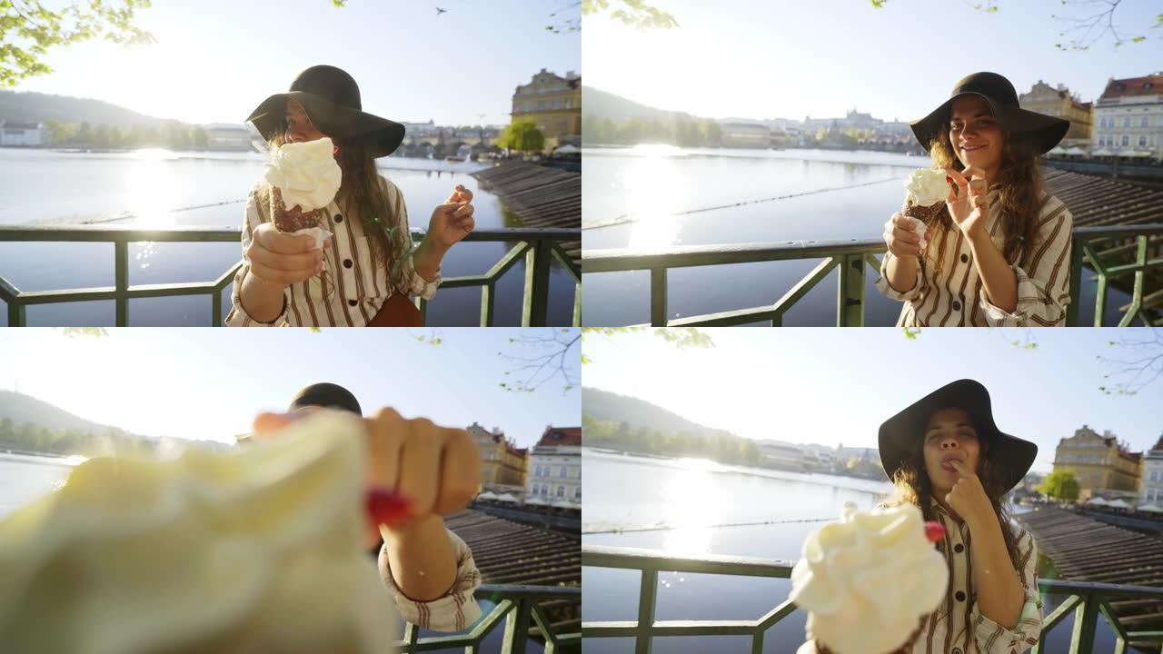 女孩在伏尔塔瓦河边用甜面包拉到镜头前