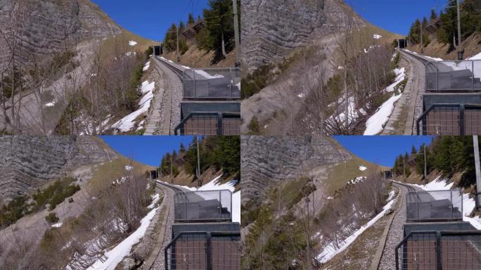 齿轮火车在铁路上的雪山中行驶。瑞士，阿尔卑斯山