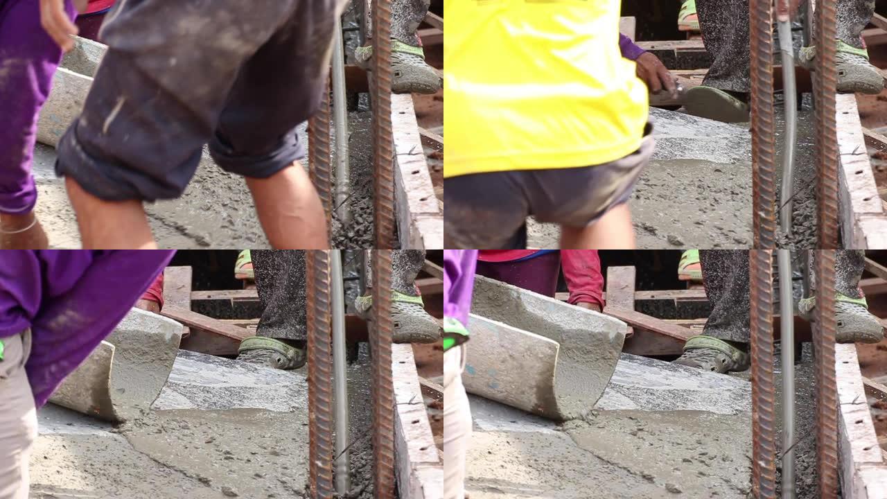 工人准备混凝土浇筑钢筋金属模板的场地