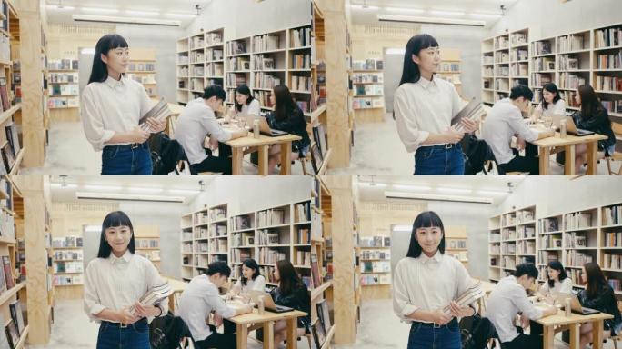 一位可爱的年轻亚洲女学生站在书店的肖像