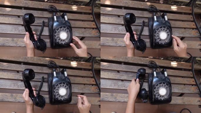 手工使用和拨打老式电话的镜头