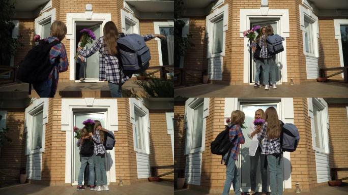 带着背包回家给妈妈带花的可爱的小男孩和女孩。