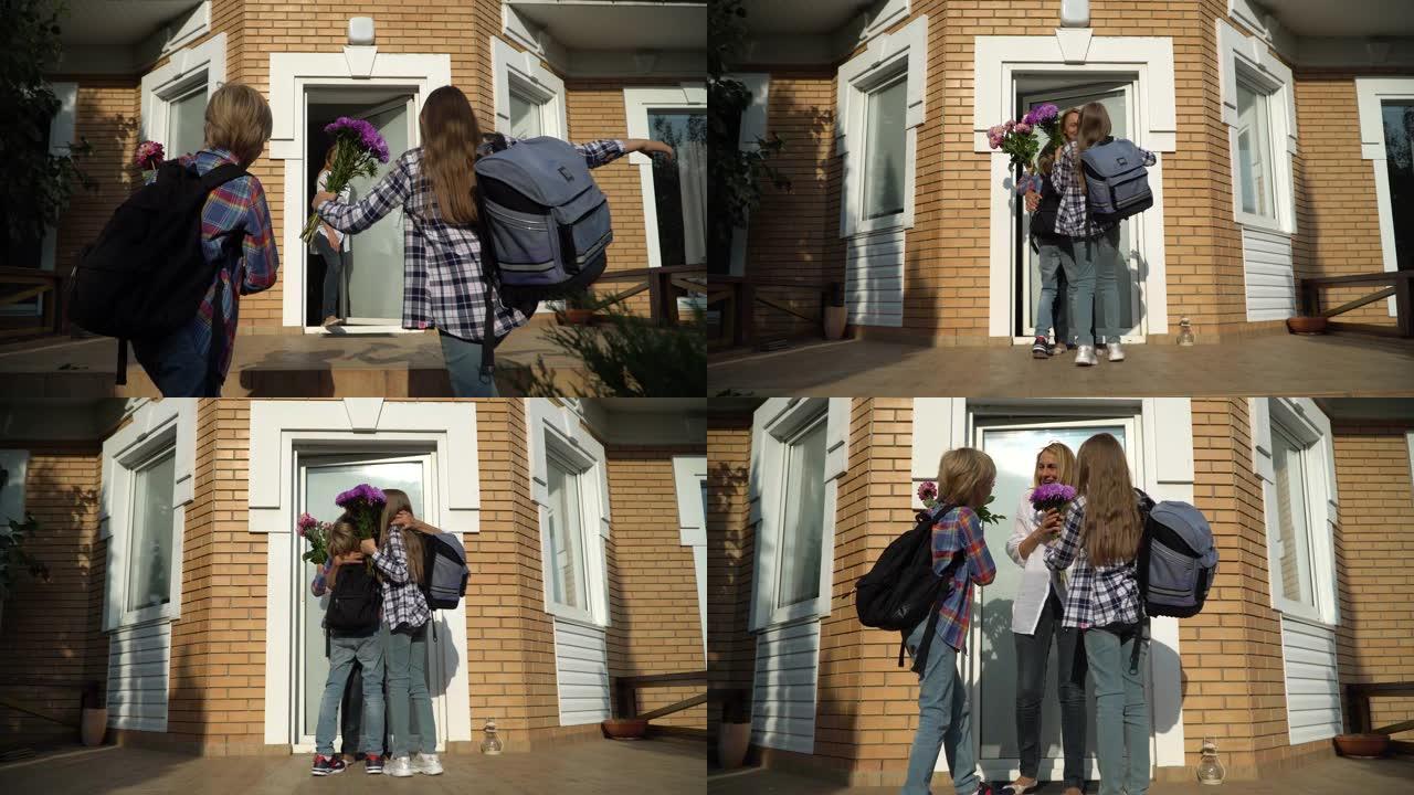 带着背包回家给妈妈带花的可爱的小男孩和女孩。