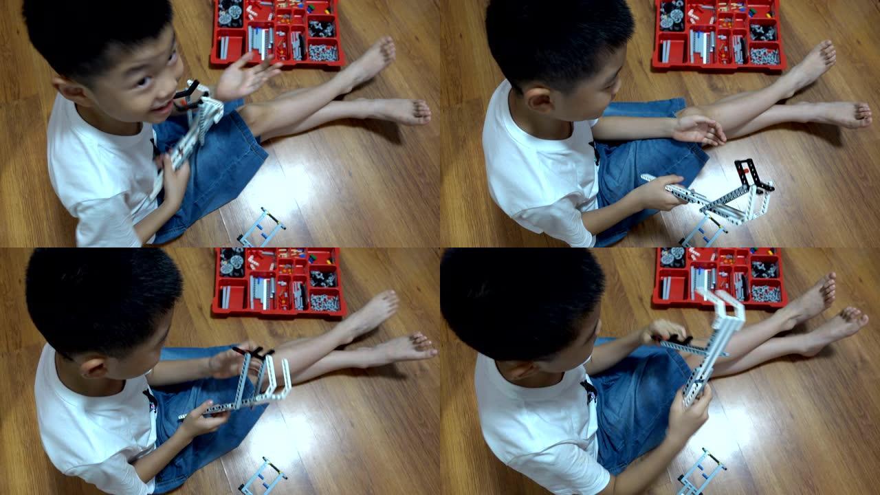 智能男孩在室内建造机器人积木