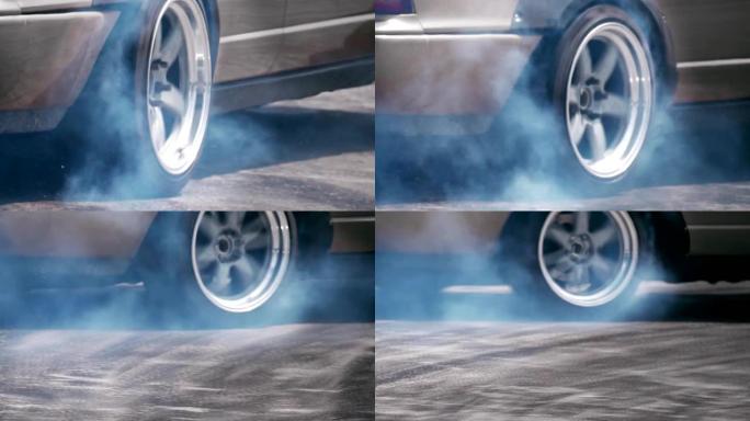 赛车漂移汽车在速度跑道上燃烧轮胎