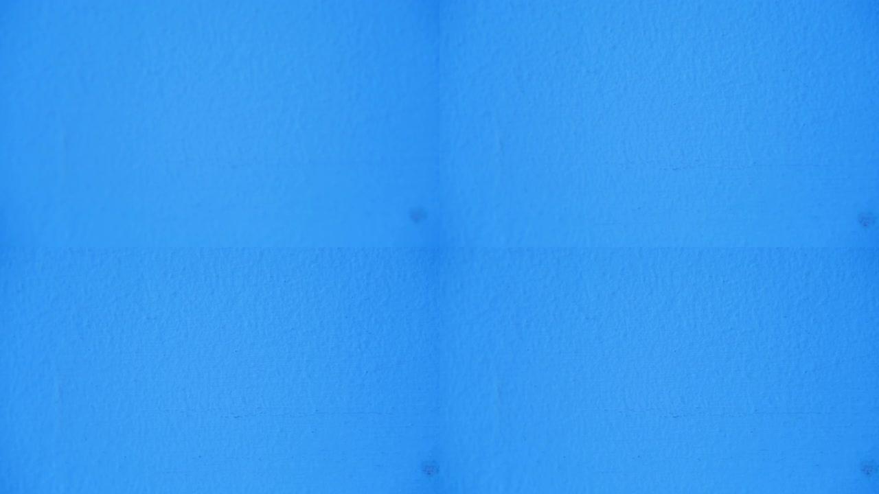 粗糙的蓝色墙壁背景