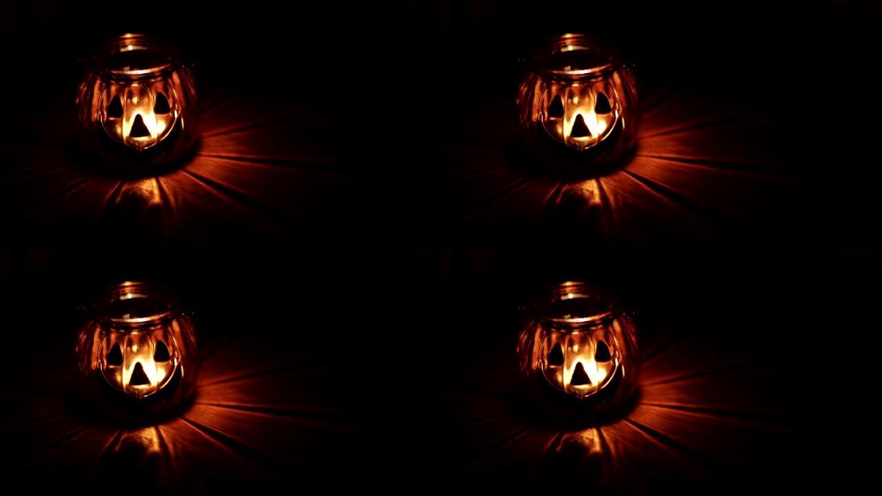 万圣节南瓜头杰克灯笼，黑色背景上燃烧着蜡烛。万圣节假期艺术设计，庆典。万圣节假日夜景