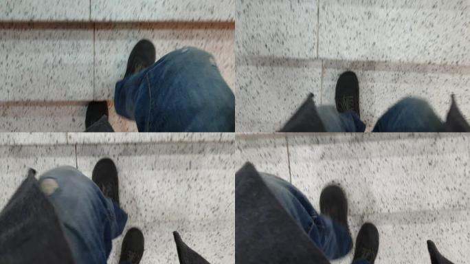 一个男人爬楼梯，男人的脚穿鞋