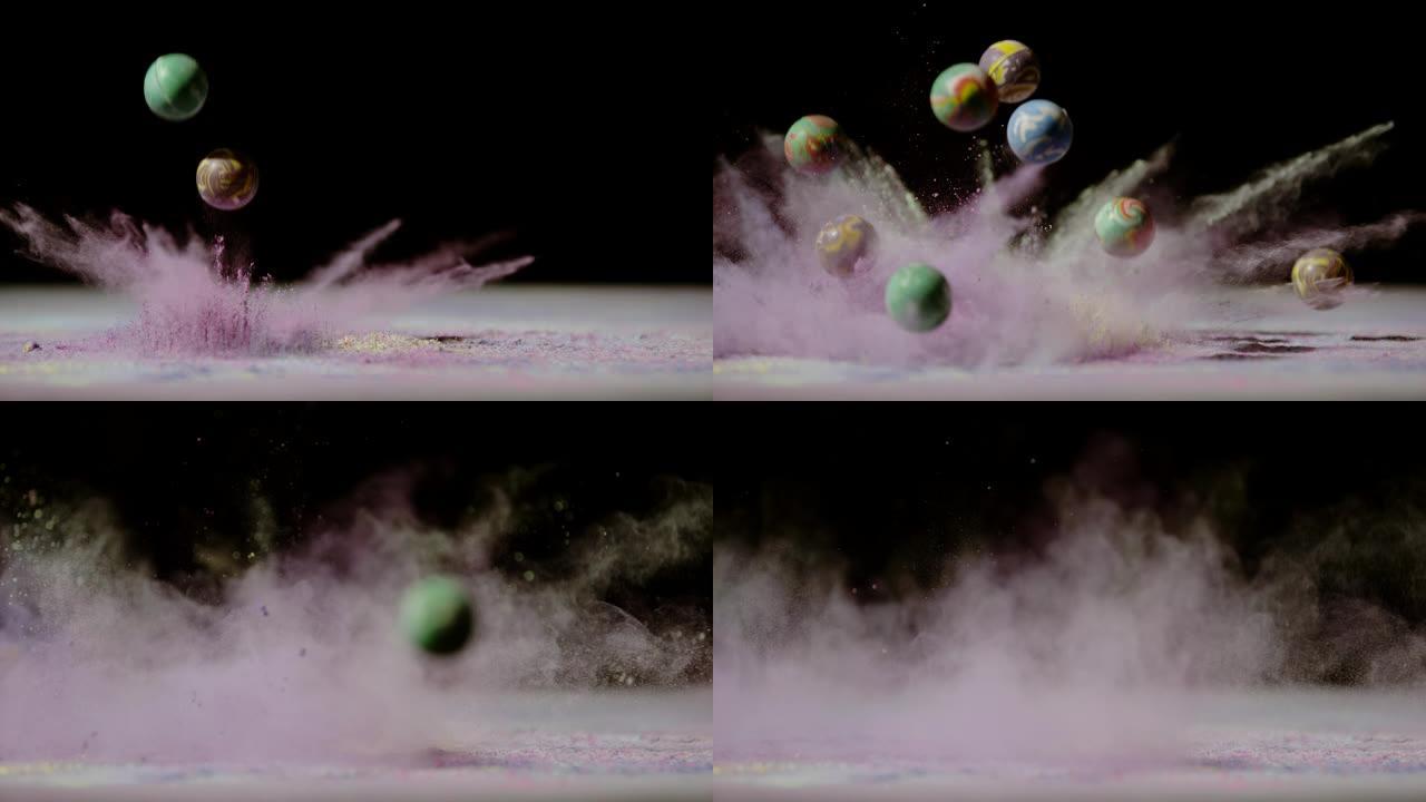 彩色橡胶球掉落在彩色粉末中，超慢动作