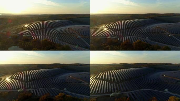 空中无人机镜头。日落秋季飞往太阳能站农场