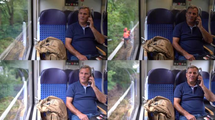 坐在高速火车上使用电话的成熟男人