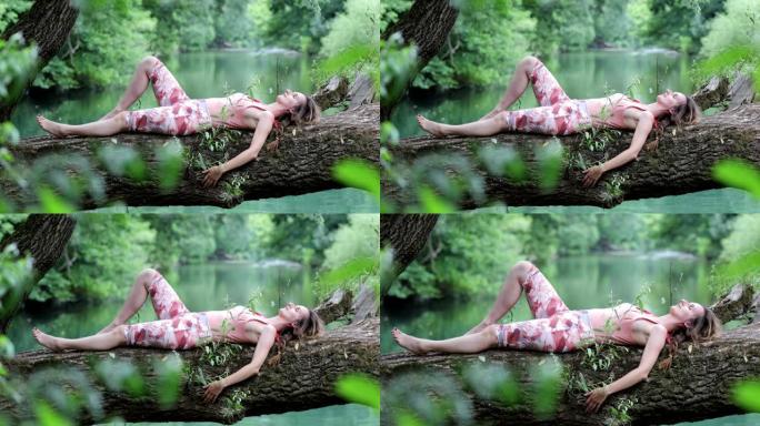 成年妇女在河上的一棵树上放松
