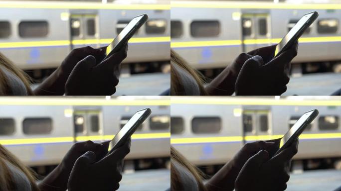 4k特写旅游亚洲女子在地铁里拿着手机打字