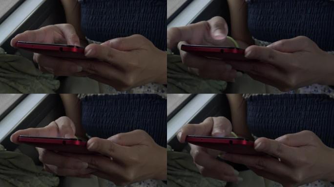 特写镜头亚洲女性在公共汽车上使用触摸屏平板智能手机设备4k