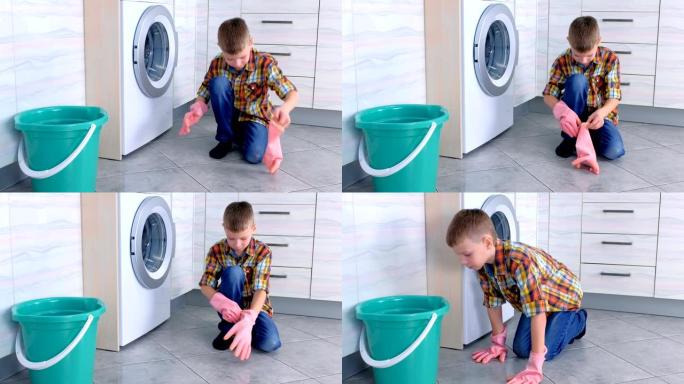 男孩戴上橡胶手套清洁厨房地板。孩子的家庭职责。