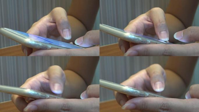 使用触摸屏平板智能手机设备4K的特写亚洲女性手