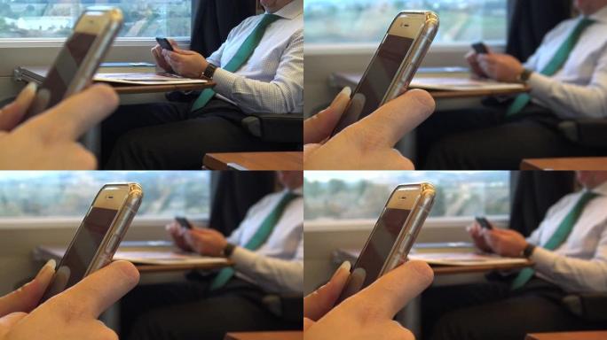 4k亚洲女性在火车上使用移动触摸屏智能手机做工作